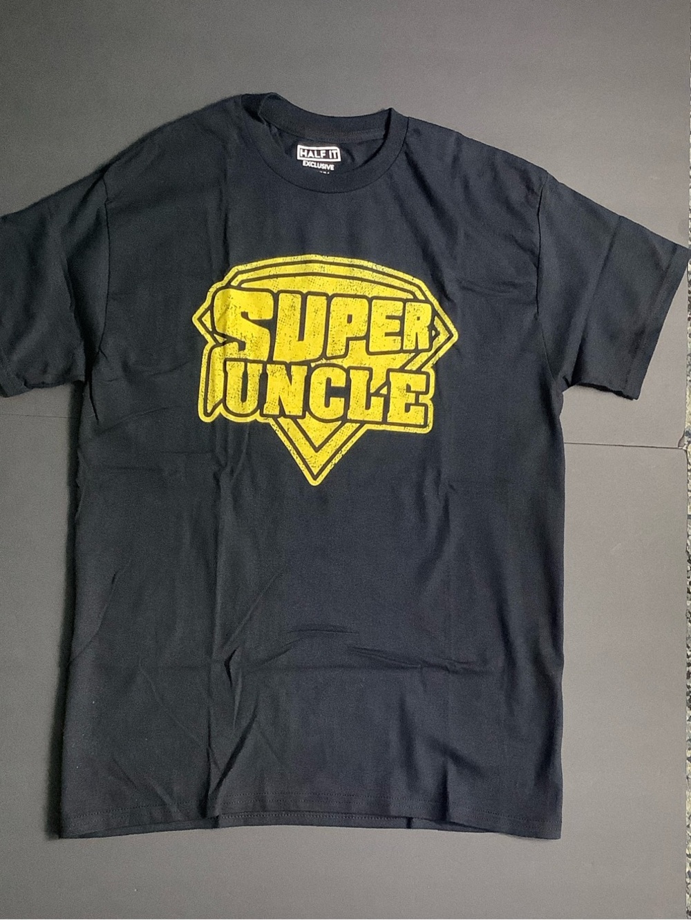 Half It Black Short Sleeve Tee with Yellow "Super Uncle" Graphic Medium
